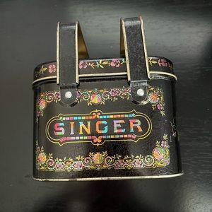 Singer multicolored tin with handles